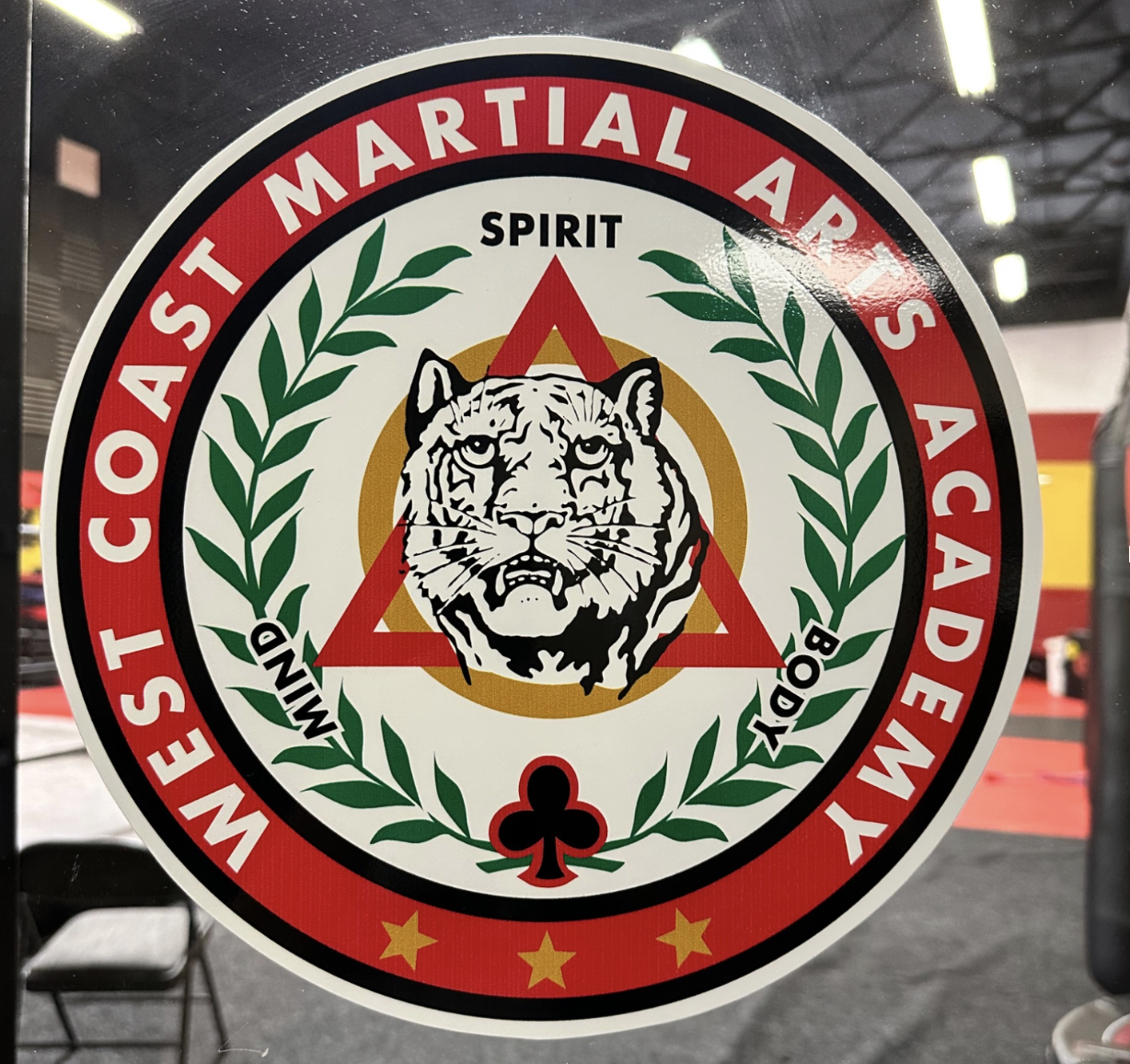 West Coast Martial Arts Academy crest
